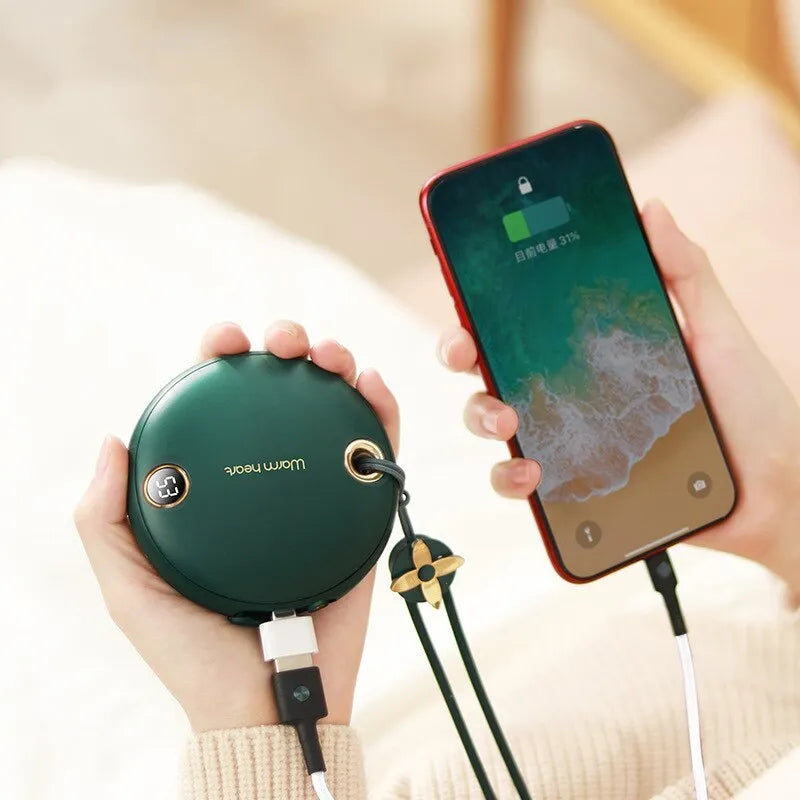 Green, pink, or white hand warmer power bank with digital display showing charge level