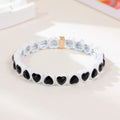 Rainbow enamel heart bracelet in alloy with colourful stretch band and unisex styling