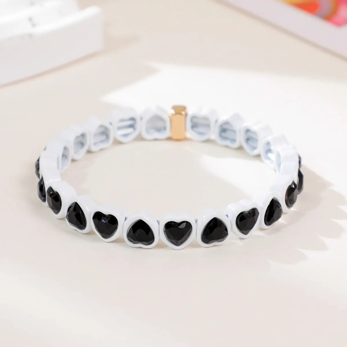 Rainbow enamel heart bracelet in alloy with colourful stretch band and unisex styling