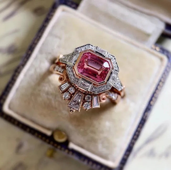 Retro-style rose gold women's alloy ring with geometric shape and ruby design.