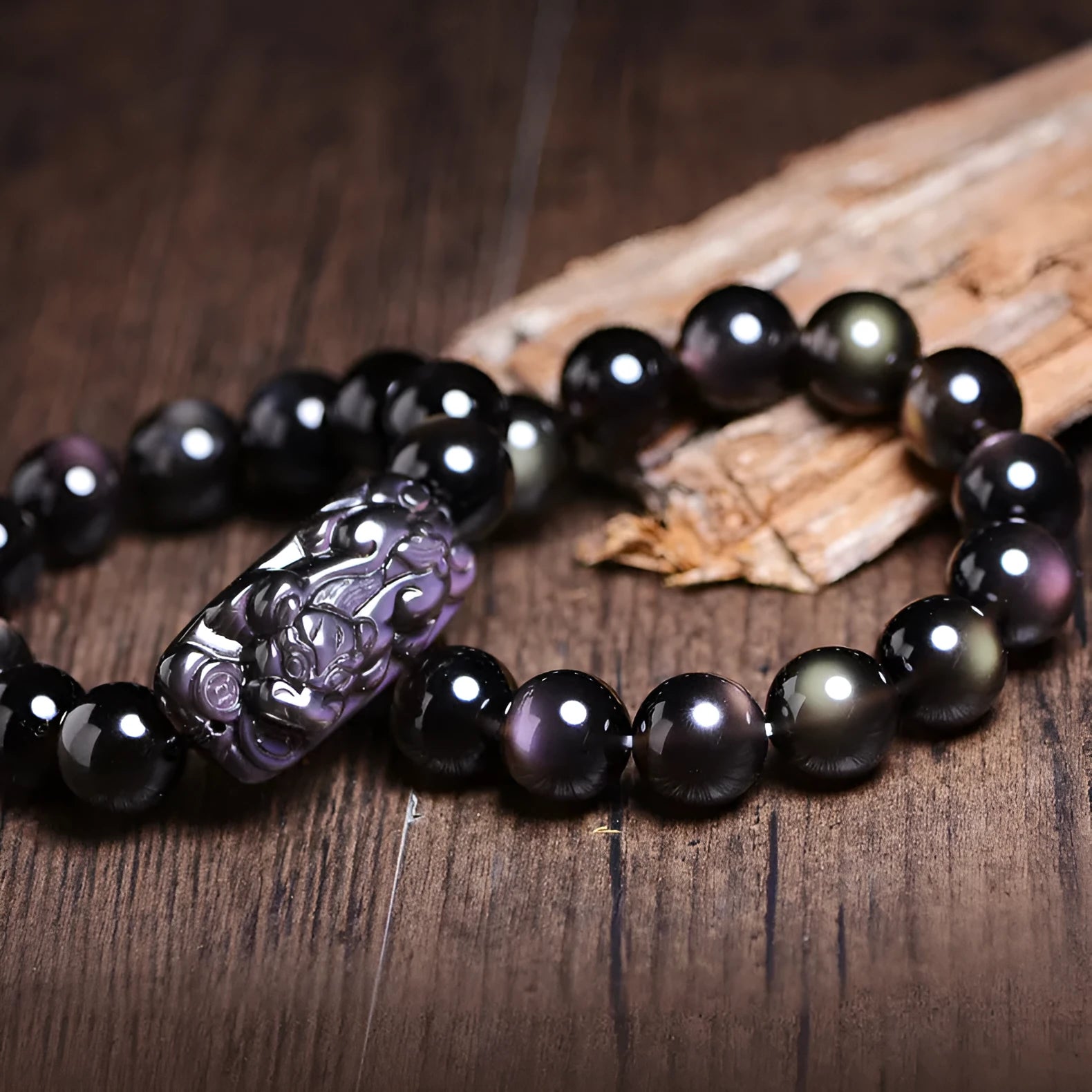 A polished crystal Pi Xiu bracelet with geometric beads on a wrist, shown in Ice Stone and Double Eye Ice Stone variants.