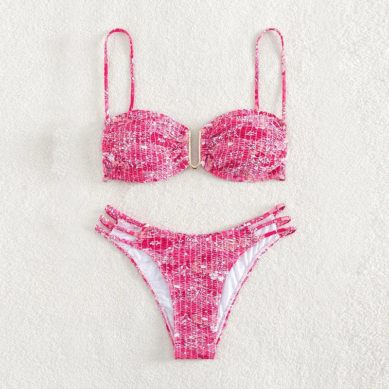 Women's high-waist floral bikini swimsuit in a solid colour on a mannequin