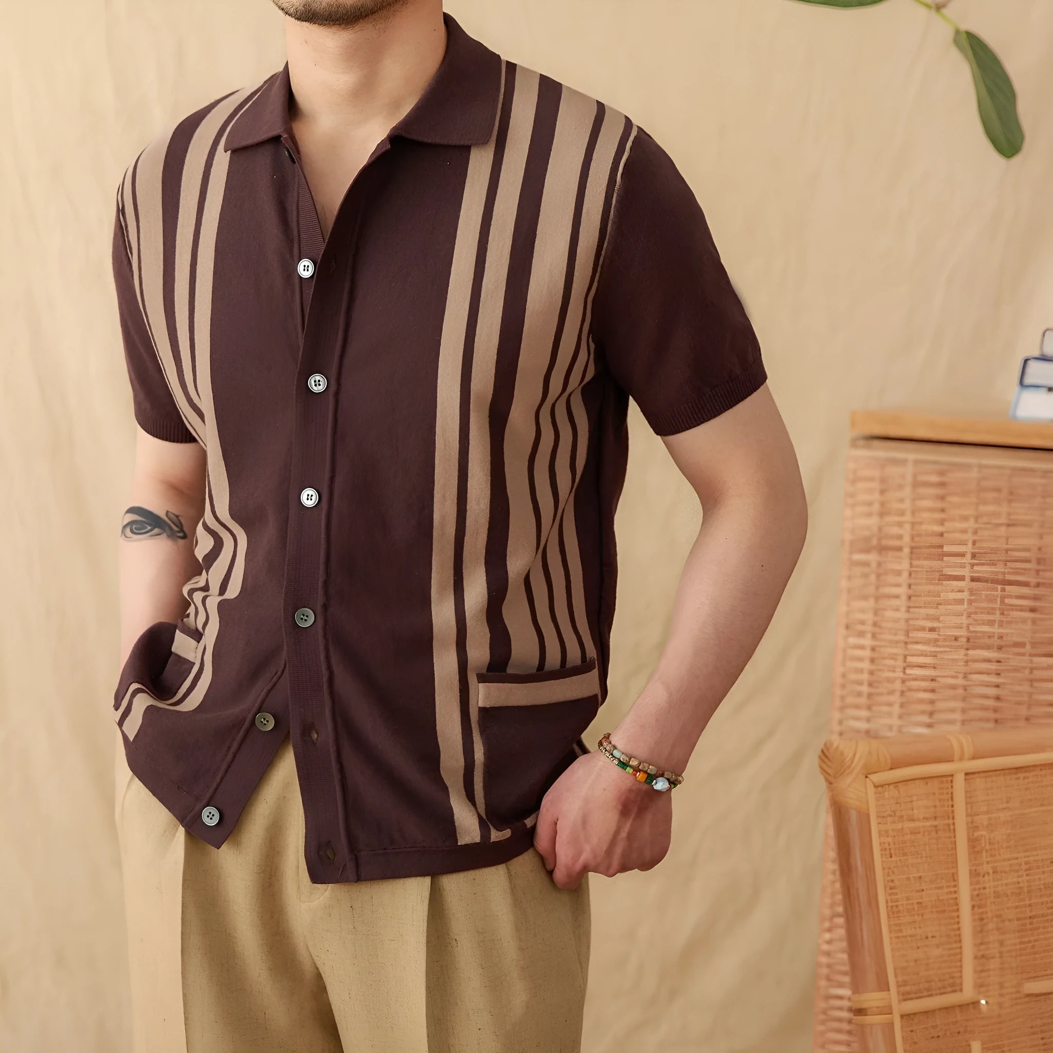 Short-sleeved striped cardigan polo shirt with a lapel collar in light blue, laid flat.
