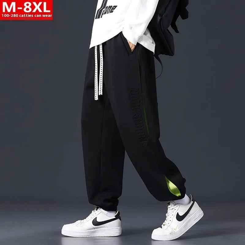 Men's black ankle banded trousers with stitching detail and cotton micro-elastic fabric