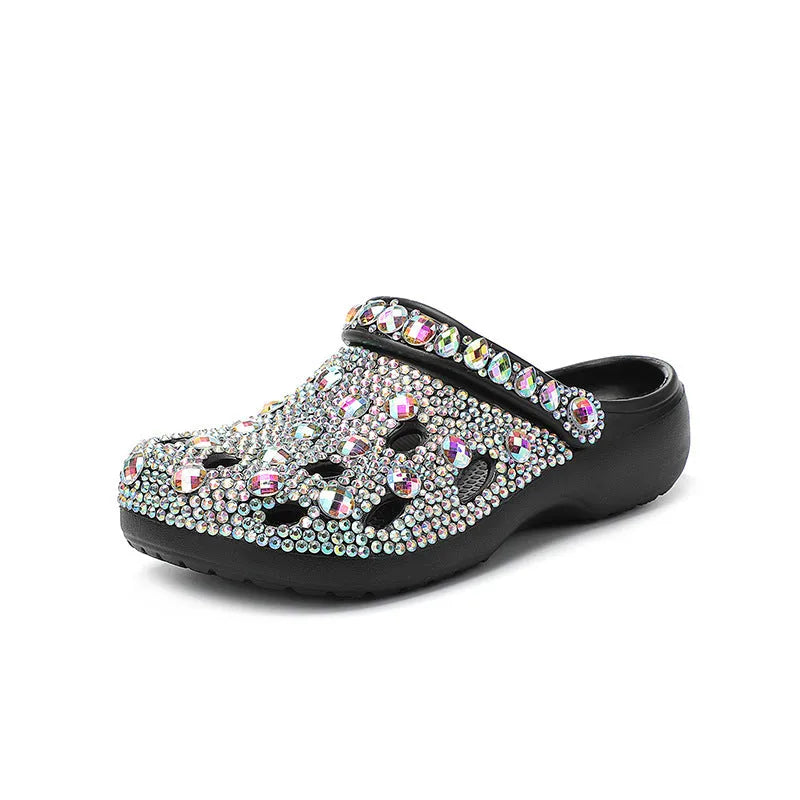 Black women's platform sandals with rhinestone detail and an open hole design on the EVA upper.