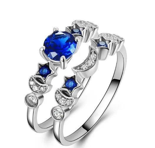 Creative moon ring with blue gemstone inlay on display showing detailed crescent design and stone setting.