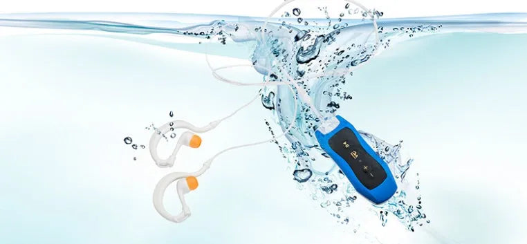 Compact black waterproof MP3 player for swimming with a connected earphone.