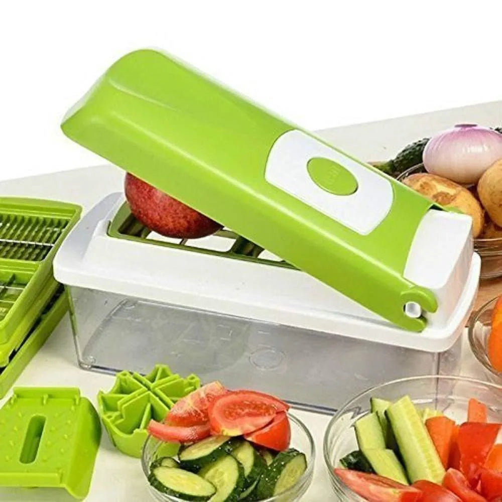 Green manual vegetable chopper with stainless steel blades on a kitchen counter