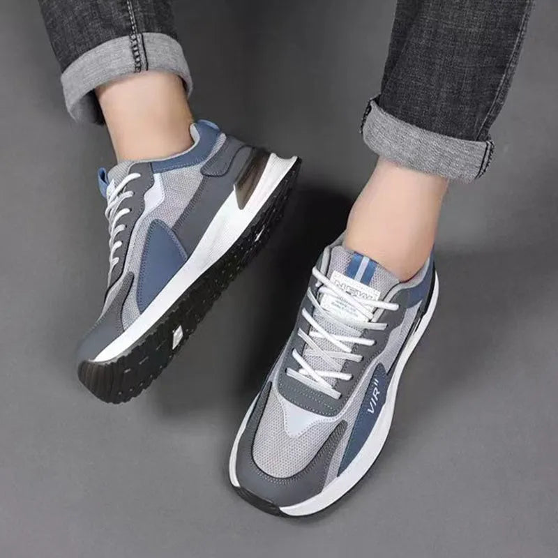 Men's colour block mesh lace-up sneakers in black, grey, and white on a injection moulded sole.