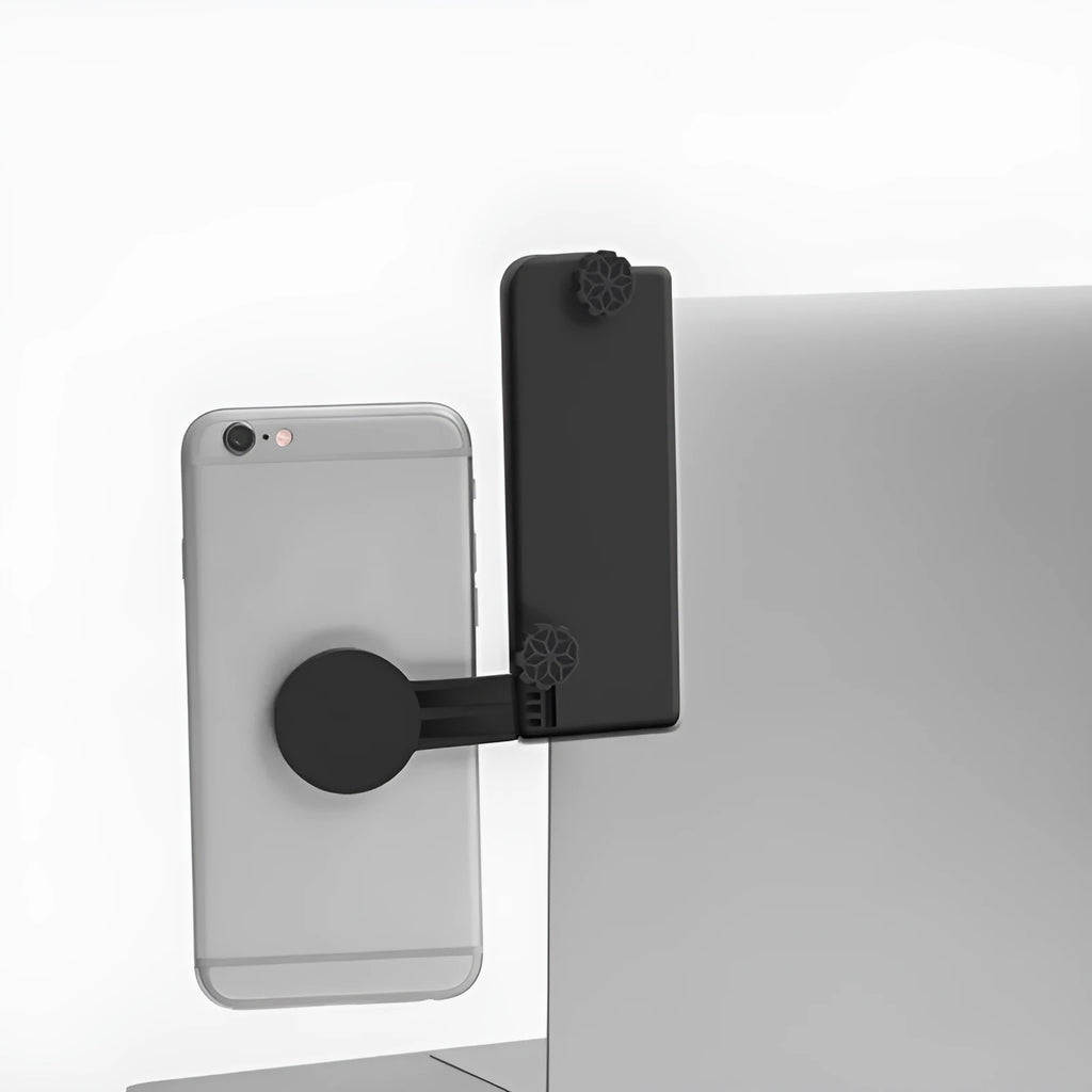 Black silicone phone holder stand clipped to a laptop, holding a mobile phone for multi-screen use, 11x10x1cm.