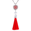 Tassel aromatherapy car pendant with alloy chain hanging from a rear-view mirror.