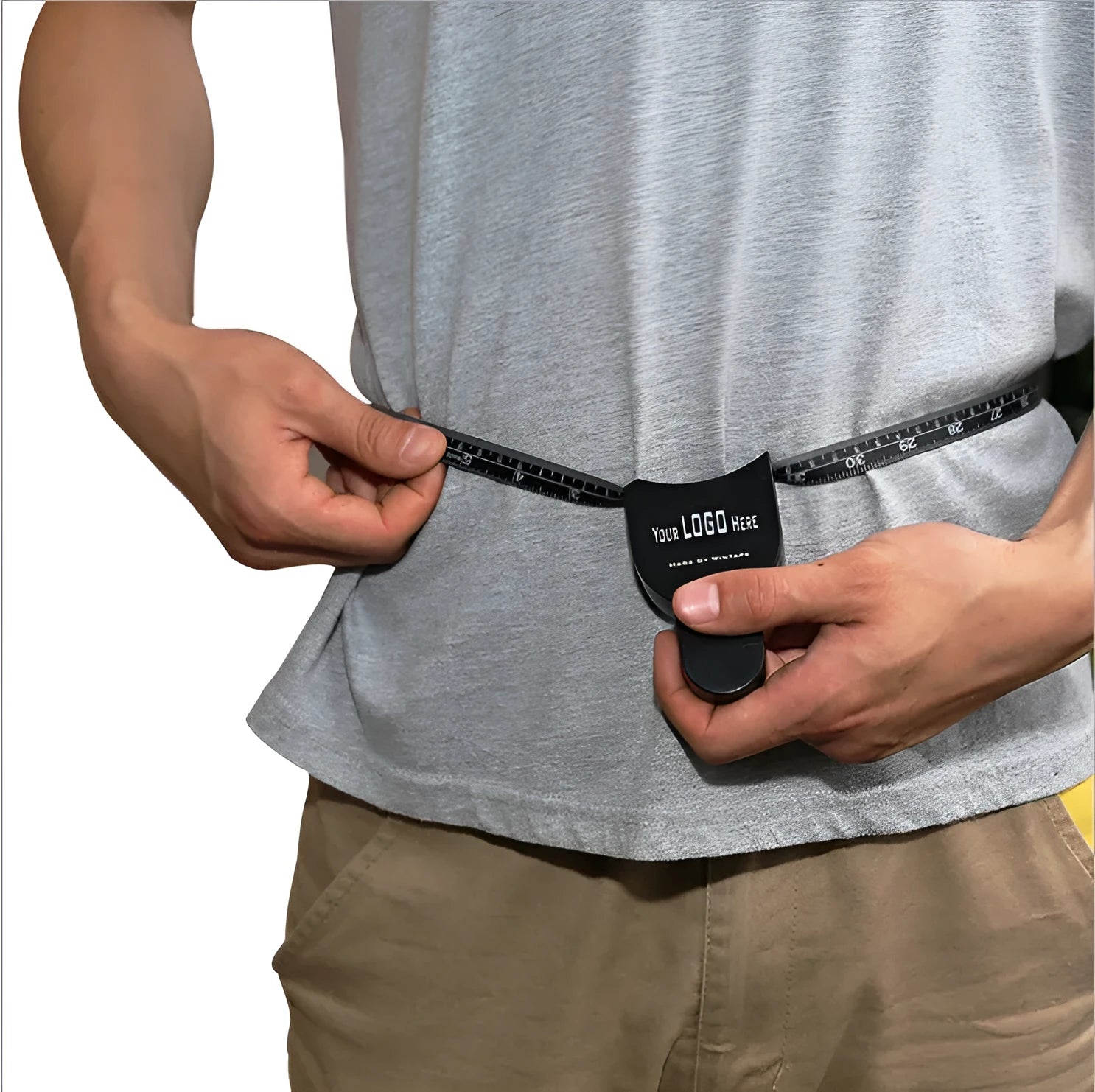 Black body fat caliper skin fold measuring instrument with two coiled measuring tapes on a grey background.