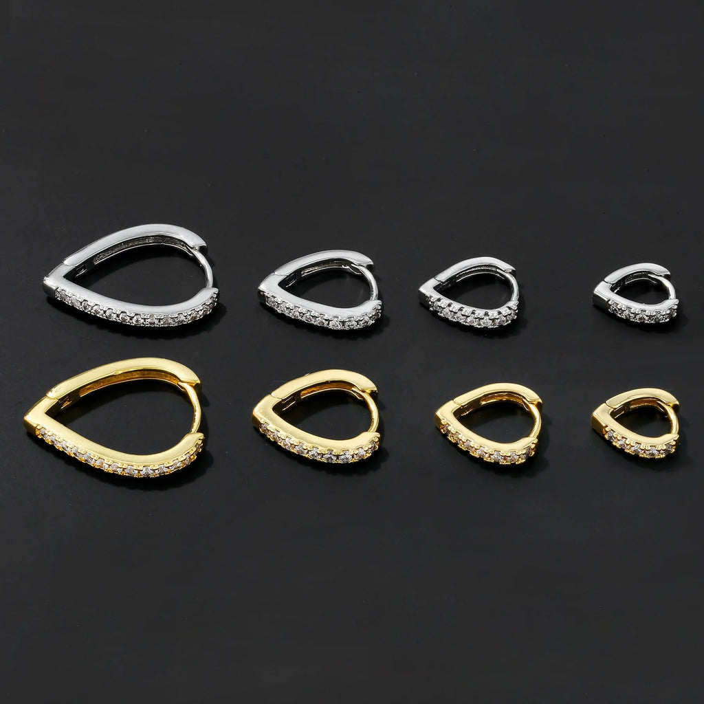 Geometric heart-shaped copper ear clip with electroplated gold or white finish on a white background.
