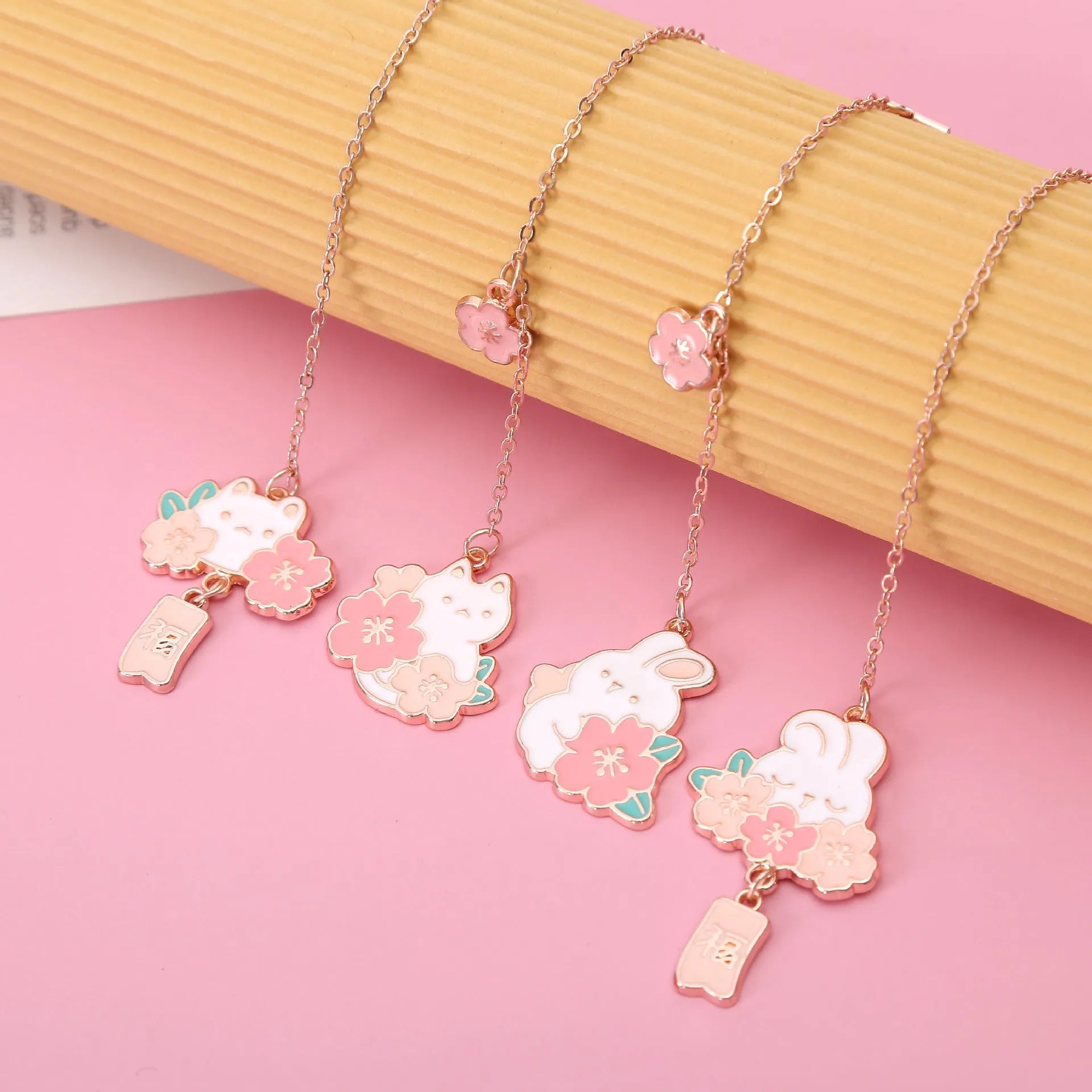 Metal pendant bookmark with cherry blossom cat design and sakura motifs
