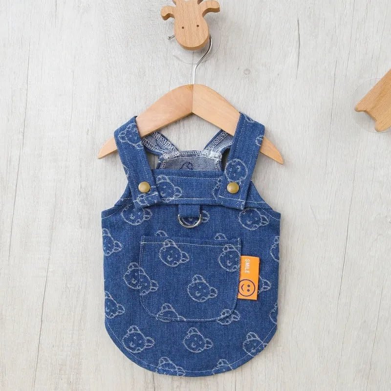 Small dog wearing denim princess dress with bracket skirt design in blue denim fabric