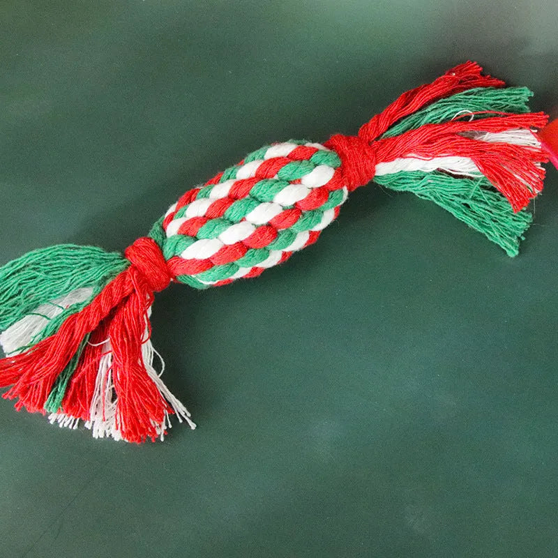 Four Christmas-themed cotton rope dog toys in red and green, including candy cane, bone, crutch, and tree shapes
