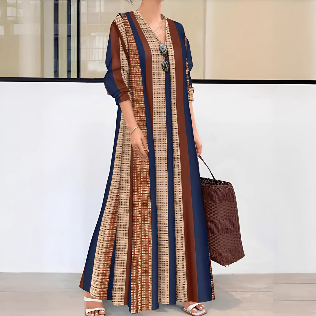 Camel coloured women's knitted dress with vertical stripes, V-neck, long sleeves, and A-line skirt.