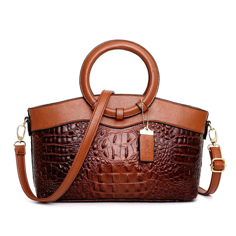 A casual fabric shoulder handbag for women in a chosen colour, showing zipper closure and internal pockets.
