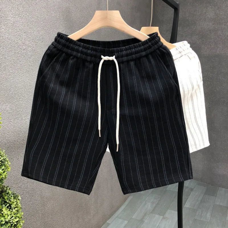 Men's black and white striped casual shorts with fleece lining and elastic waistband shown in straight cut design