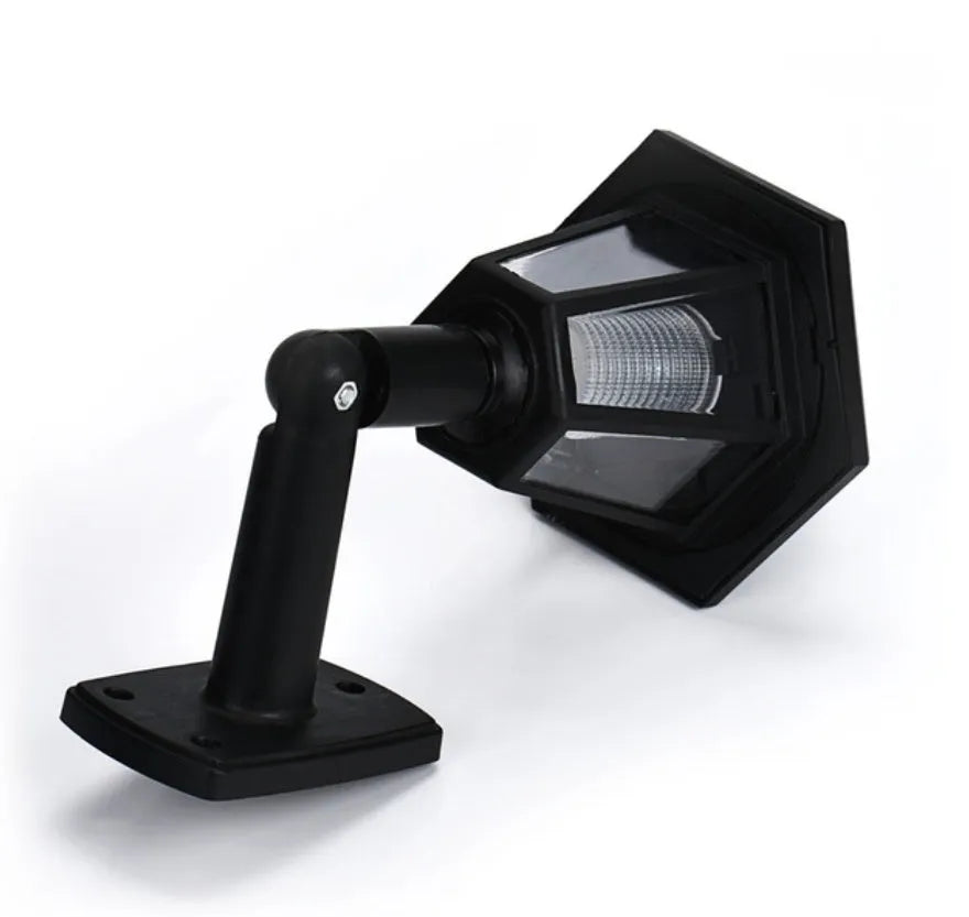 Black hexagonal solar-powered wall lamp with light sensor for outdoor use