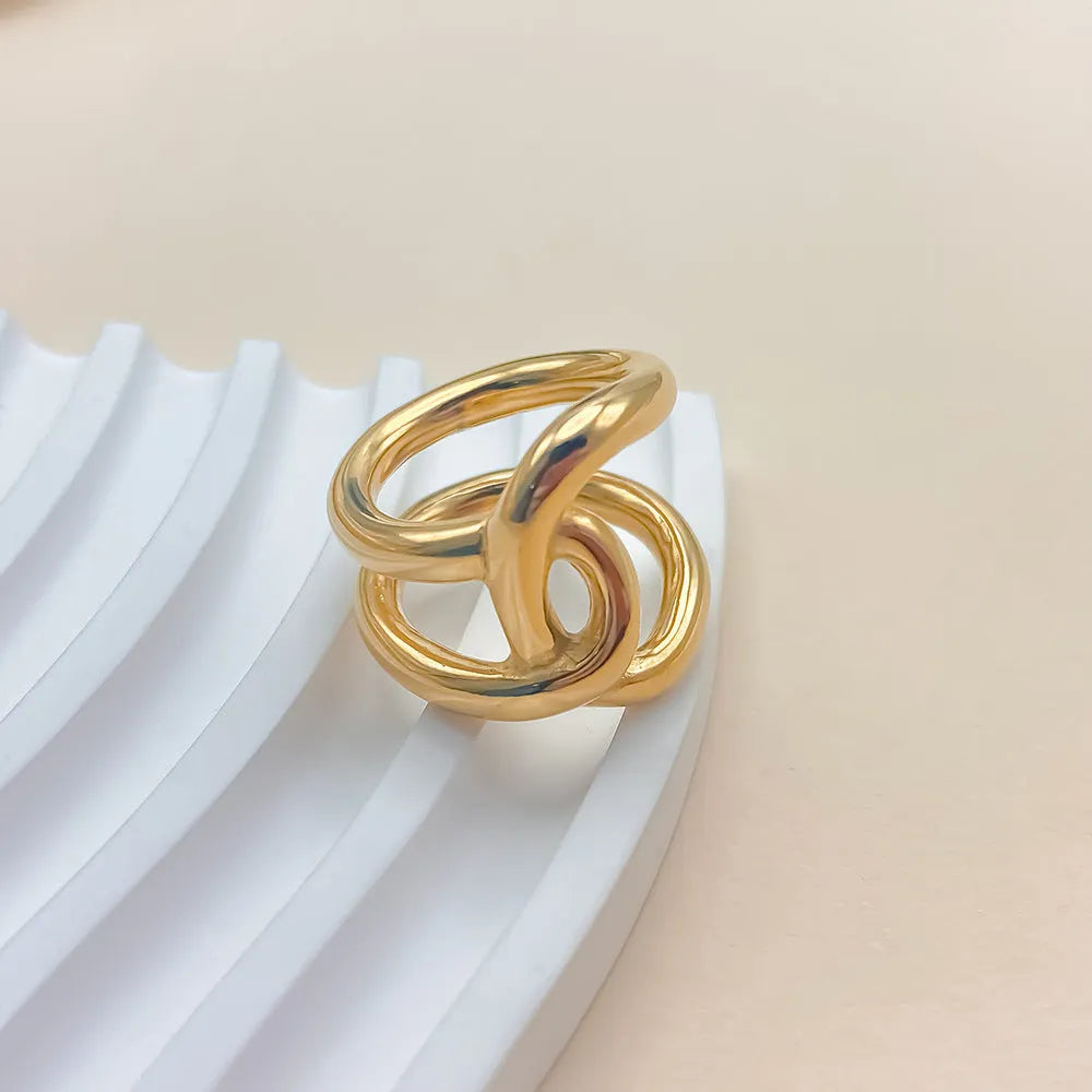 Adjustable geometric U-shaped ring with knotted design in stainless steel available in five sizes