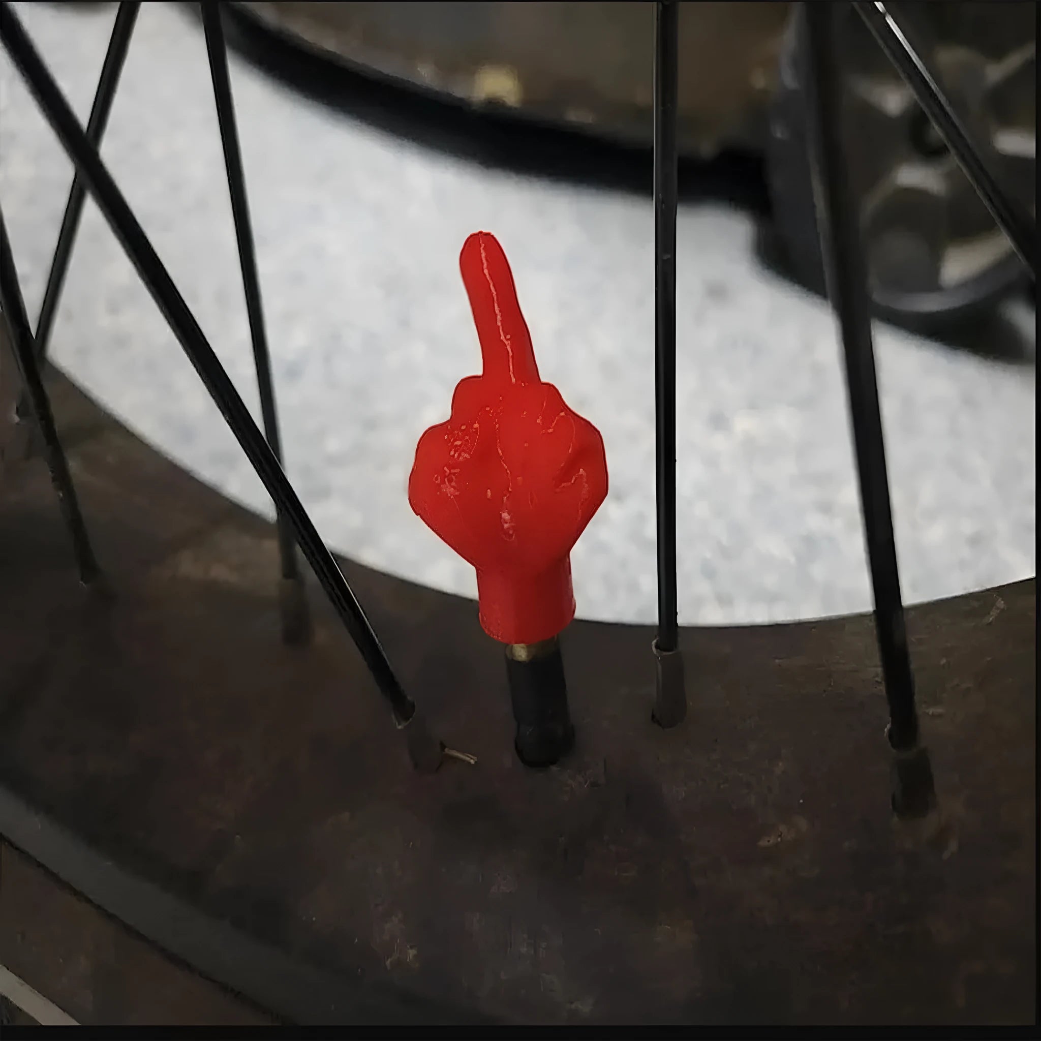 Four latex tyre valve dust caps in skin colour and black colours