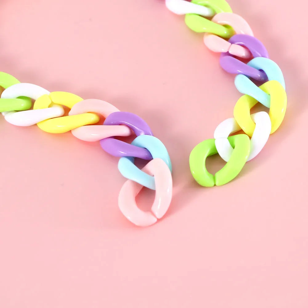 Macaron candy colour plastic pet collar on white background showing chain blue, pink and mixed colour options