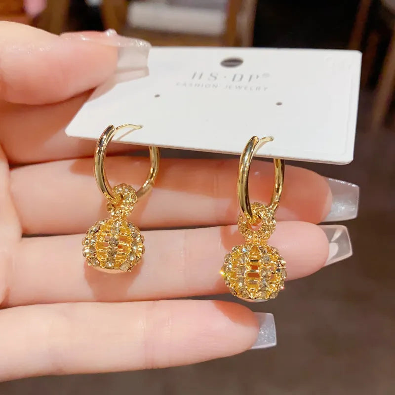 Coffee colour full diamond hollow ball ear clips with real gold plating on copper, round geometric design, 1 pair