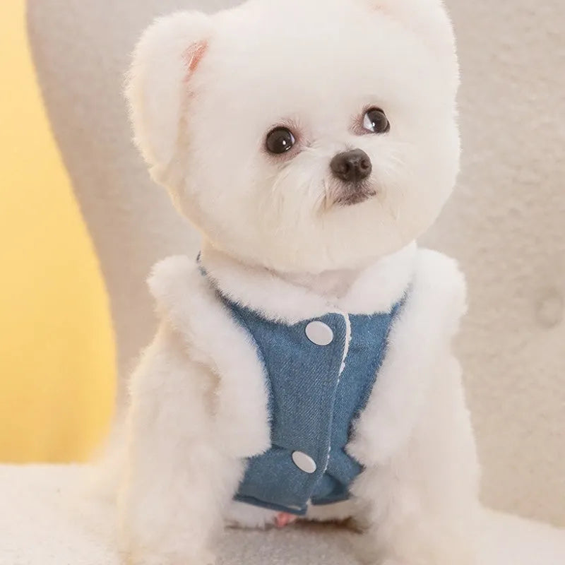 Denim blue pet vest with white wool lining, bear print, wooden buttons, and metal D-ring.