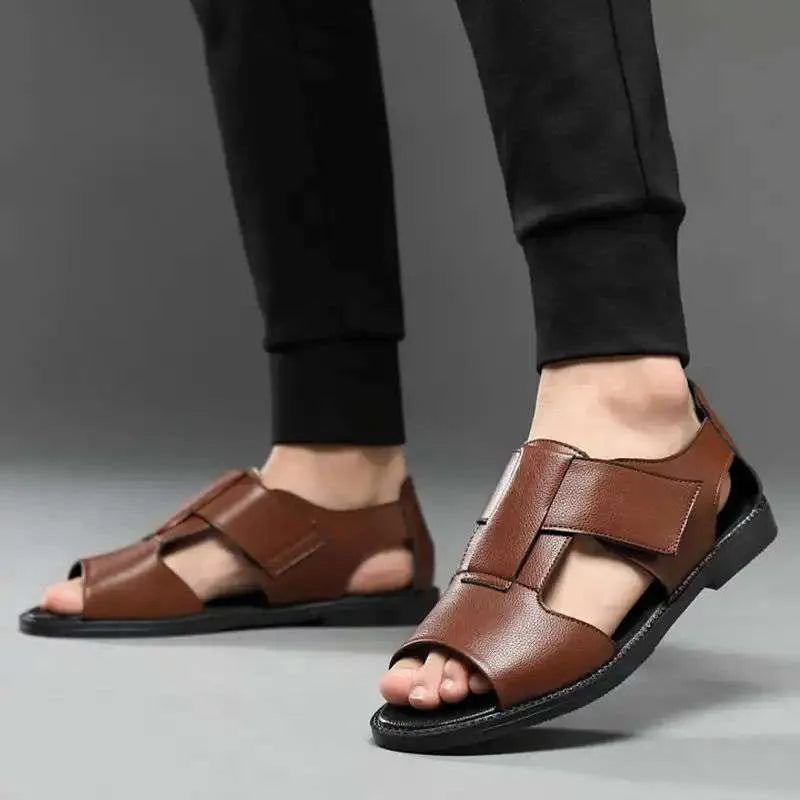 Men's black and brown leather Roman-style casual sandals with an open toe and rubber sole.