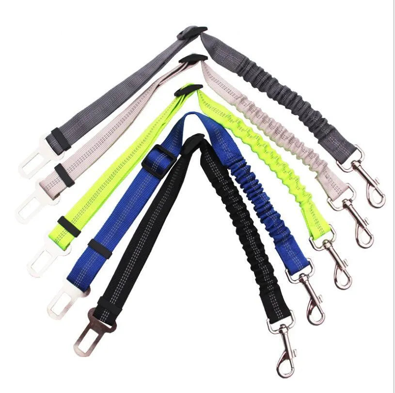 Black adjustable dog seat belt with reflective safety rope attached to car seat belt buckle, polyester webbing and alloy joint visible
