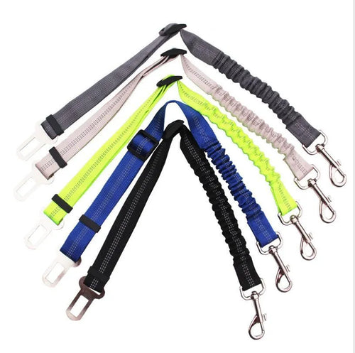 Black adjustable dog seat belt with reflective safety rope attached to car seat belt buckle, polyester webbing and alloy joint visible