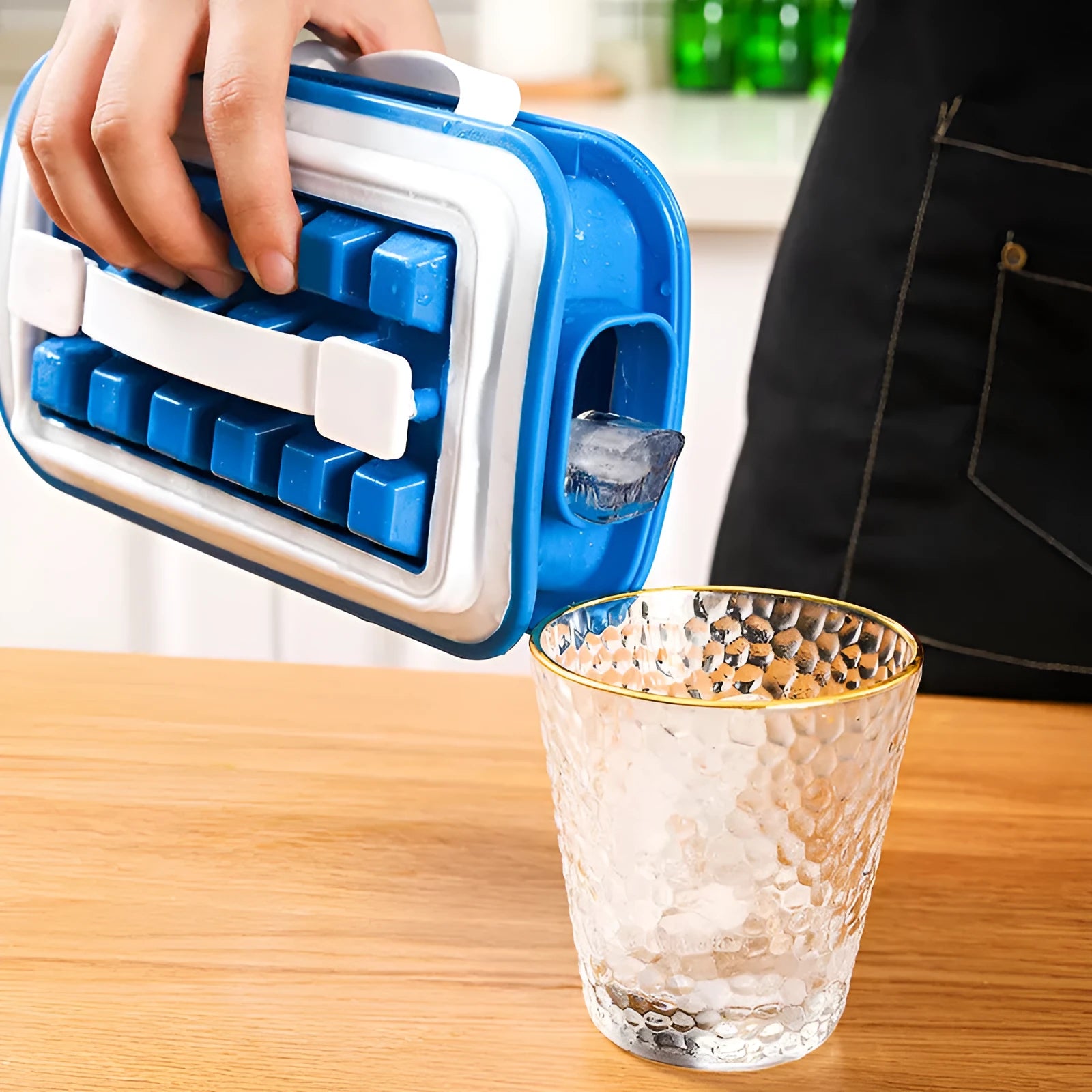 Blue silicone ice cube tray with 36 grids on a white background showing lid and one removed cube