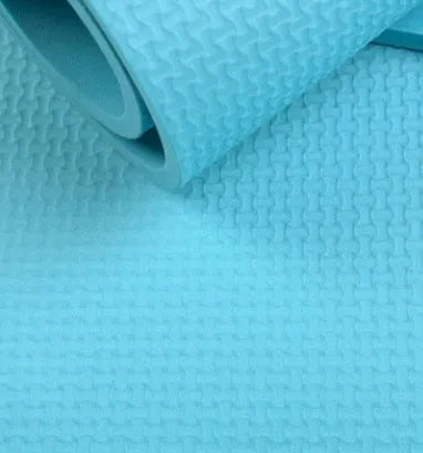 EVA yoga mat in one of six colours showing 4mm or 6mm thickness option on a floor