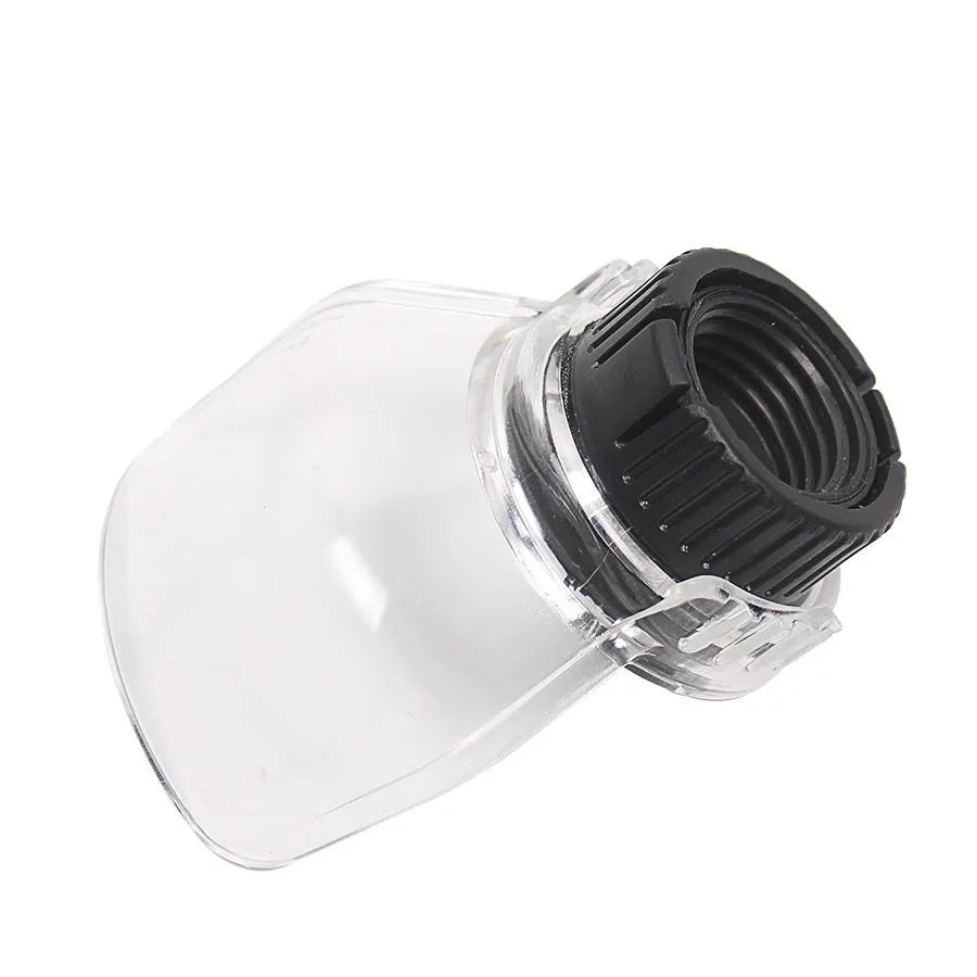 Transparent plastic horn-shaped safety cover for Delta electric grinders on a workbench.