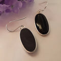 Women's geometric silver earrings with black agate oval pendants on silver chain