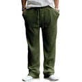 Man wearing loose-fit high-waisted straight leg casual trousers in Army Green.