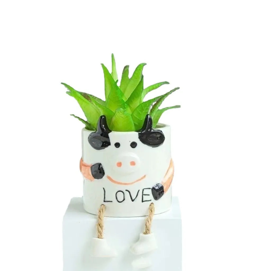 Cartoon style ceramic hanging foot flowerpot for succulents on a desktop