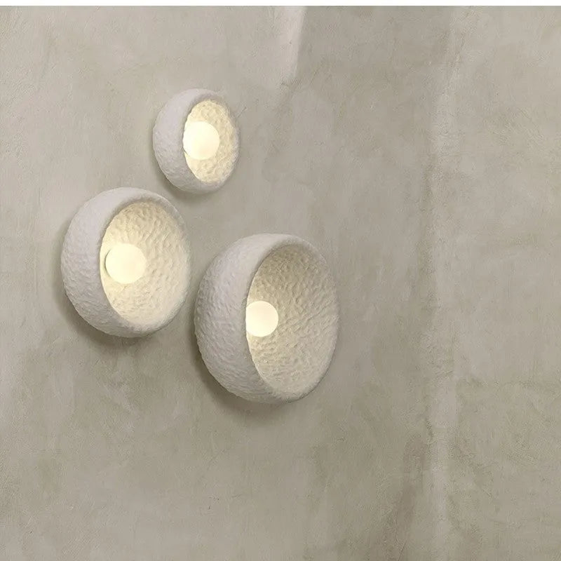 Japanese-style minimalist wall lamp with resin shade in three diameter sizes for modern interiors