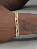 Gold-coloured titanium steel tennis bracelet with stone inlay for men and women.