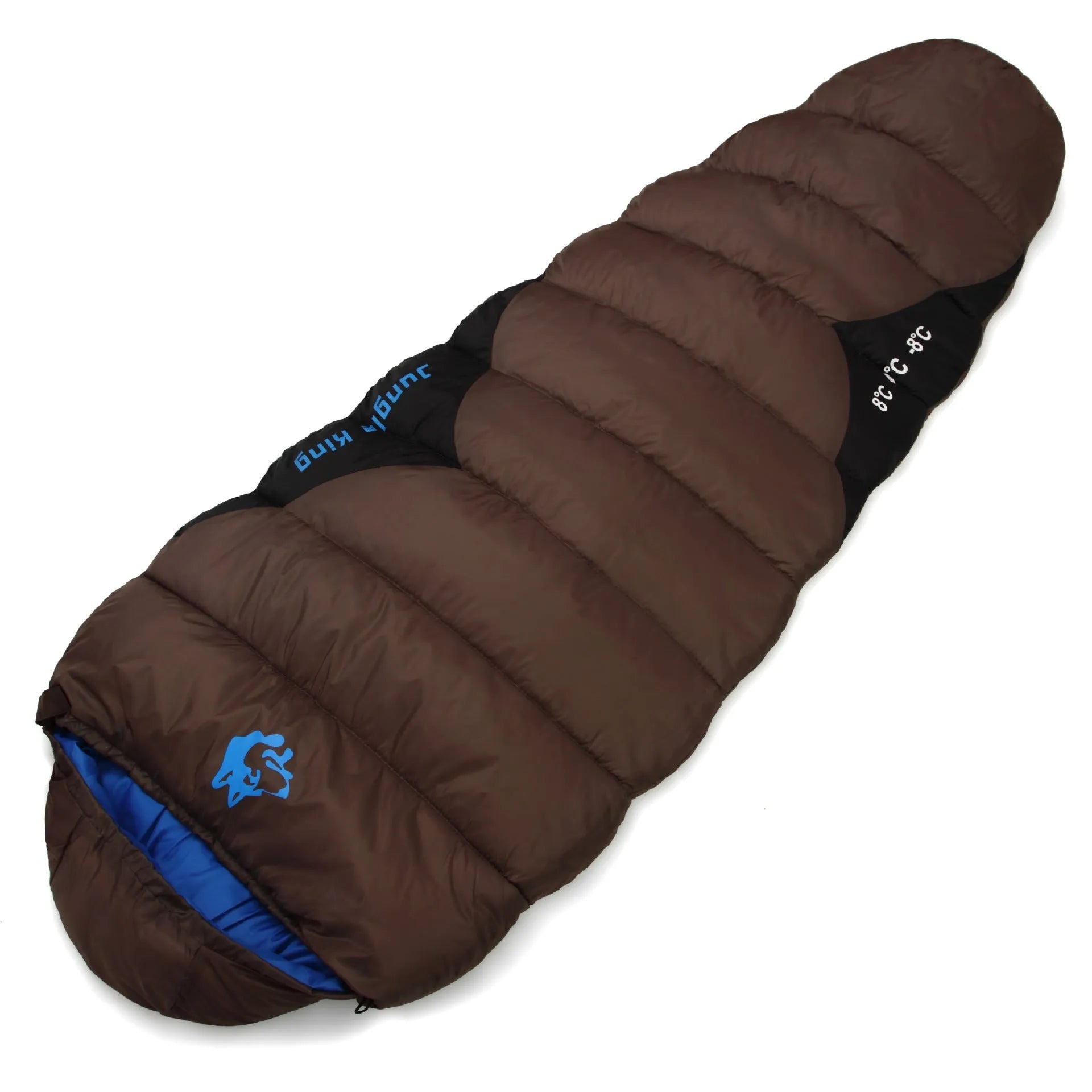 Brown cotton camping sleeping bag rolled next to its grey compression storage bag.