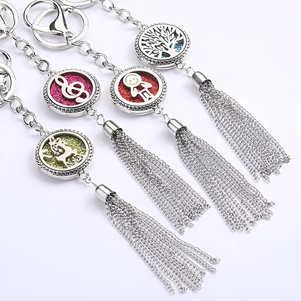 Tassel aromatherapy car pendant with alloy chain hanging from a rear-view mirror.