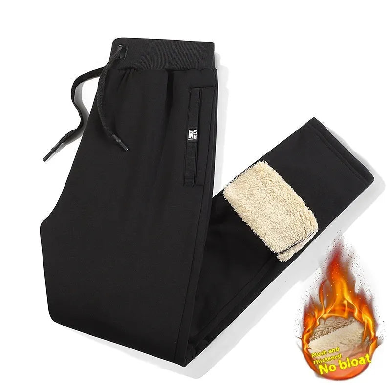 Men's grey fleece-lined cotton track pants with an elasticated waistband and drawstring, shown in an oversized fit.
