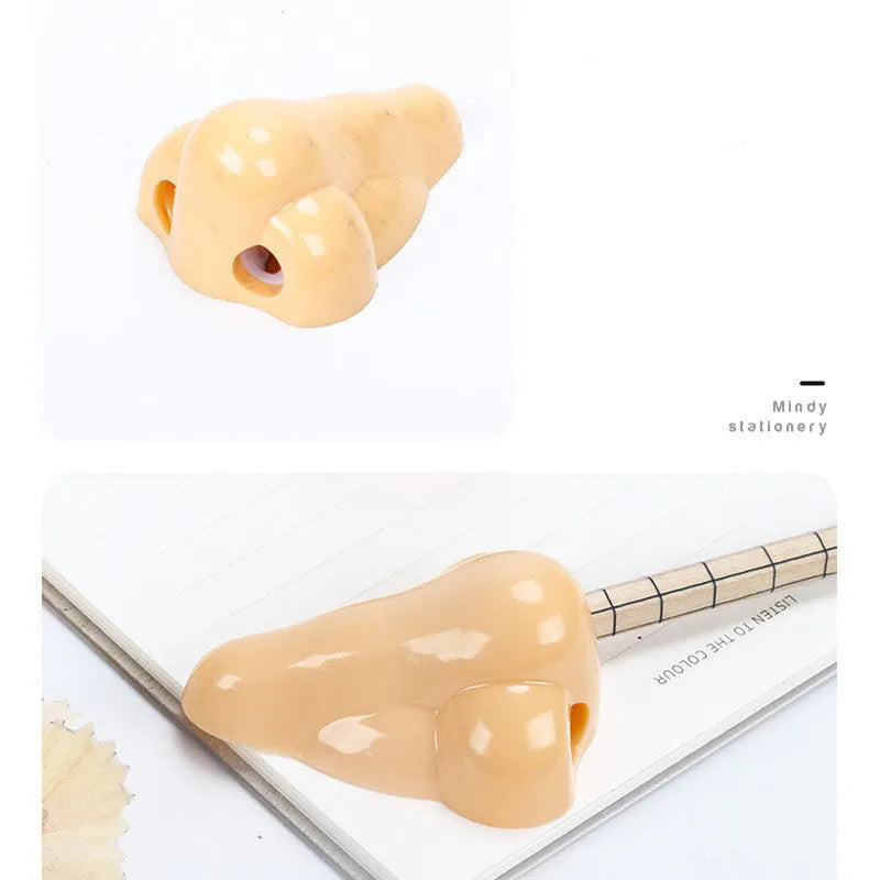 Flesh-colour plastic manual pencil sharpener with a large nostril and geometry-shaped body.