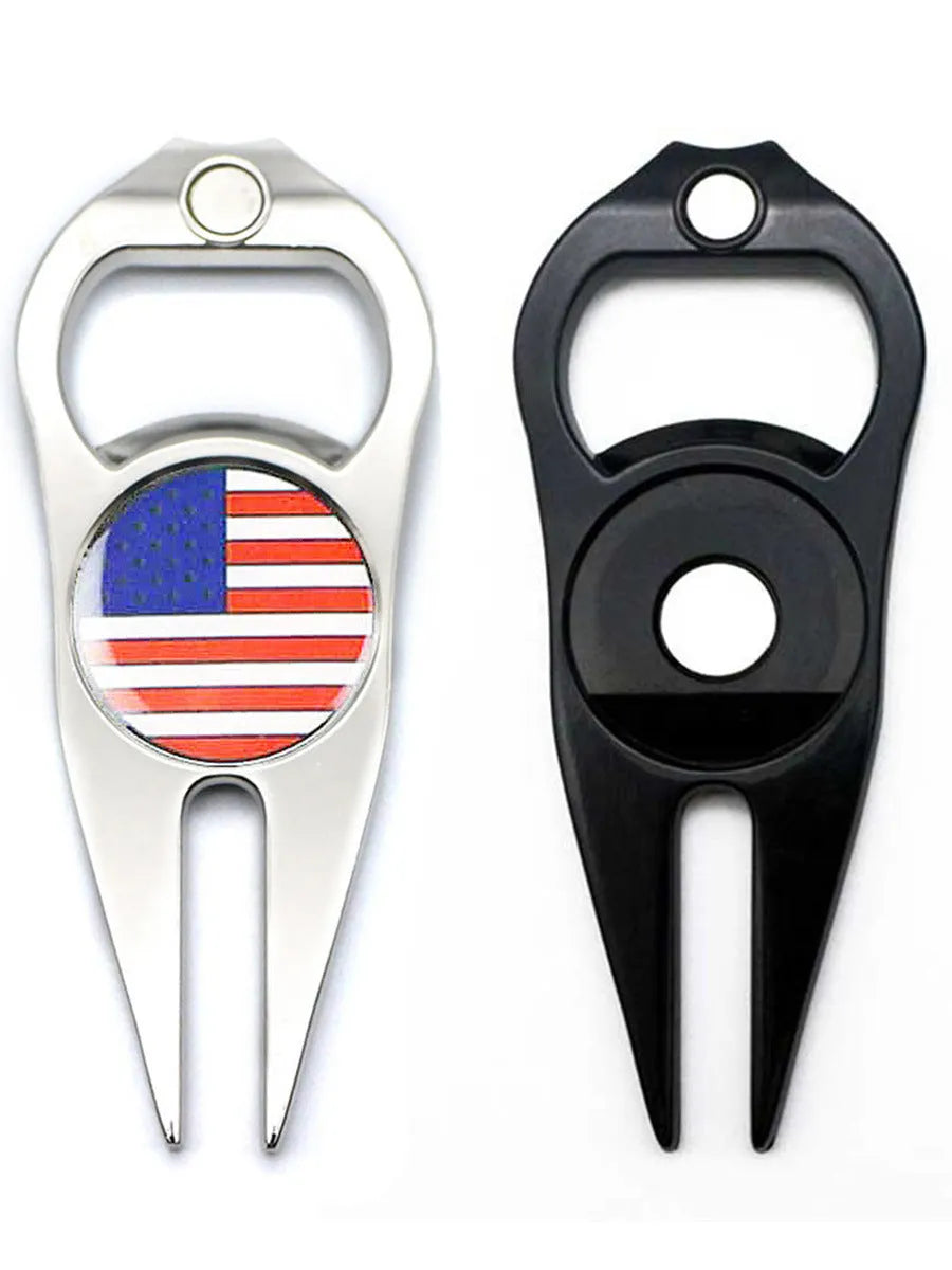 Zinc alloy golf tool with ball yoke and bottle opener, shown with a separate ball marker coin, in black, green, and silver colours.