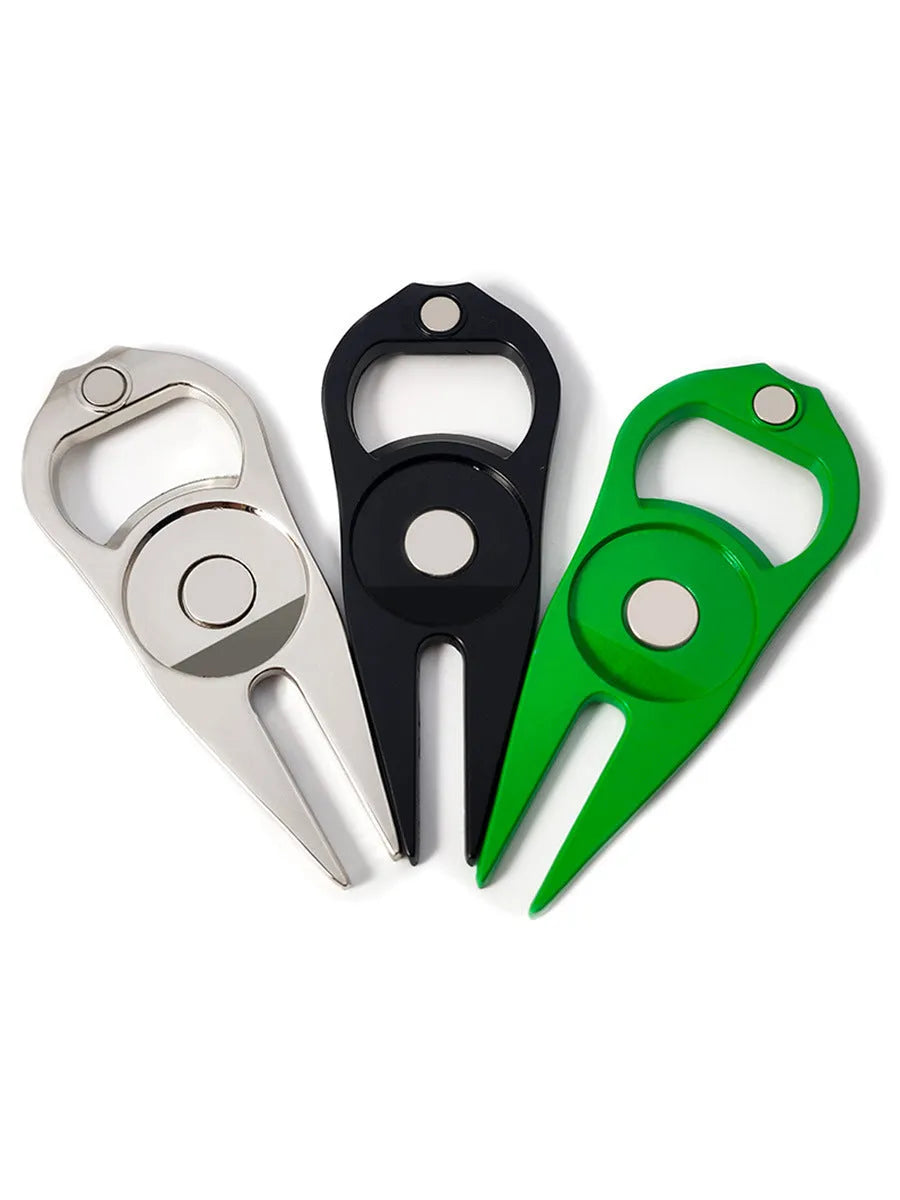 Zinc alloy golf tool with ball yoke and bottle opener, shown with a separate ball marker coin, in black, green, and silver colours.