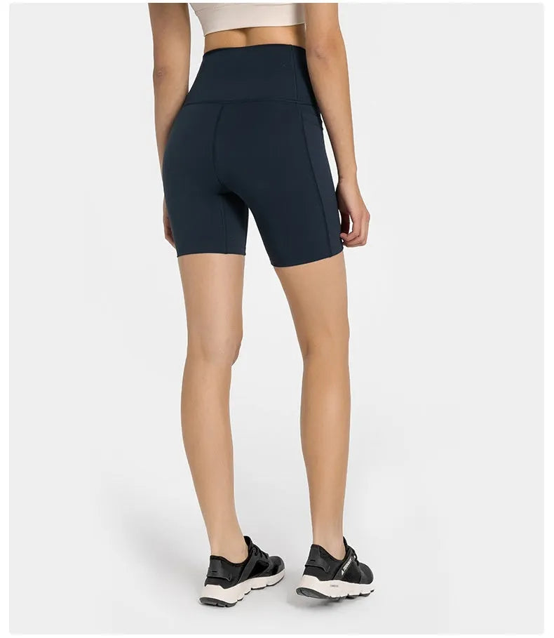 Women's tight-fitting super stretch sports shorts in a solid colour, shown on a model.