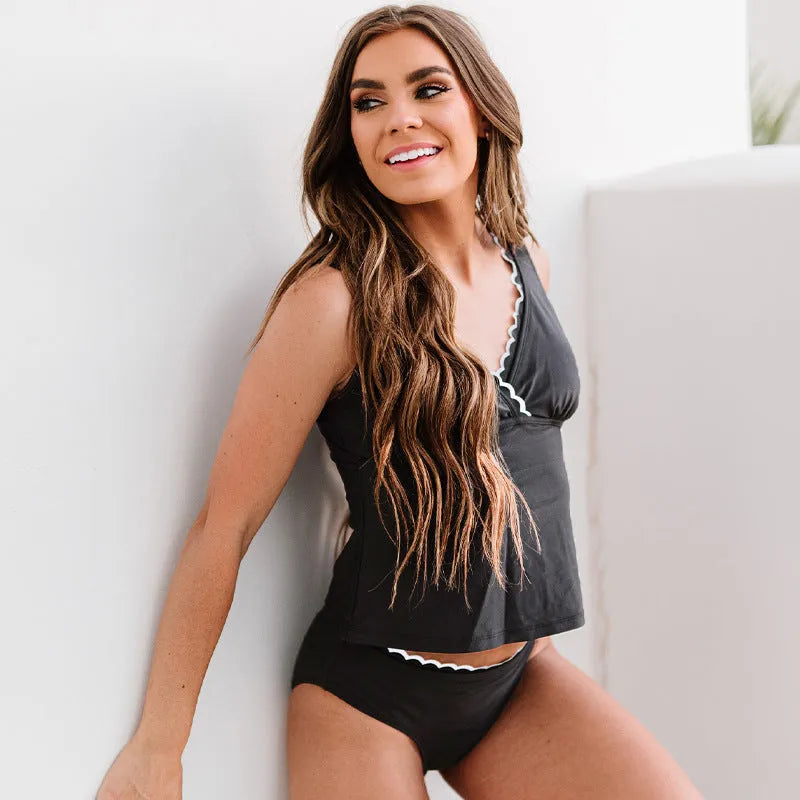 Solid black women's nylon bikini swimsuit set shown as complete one-piece set