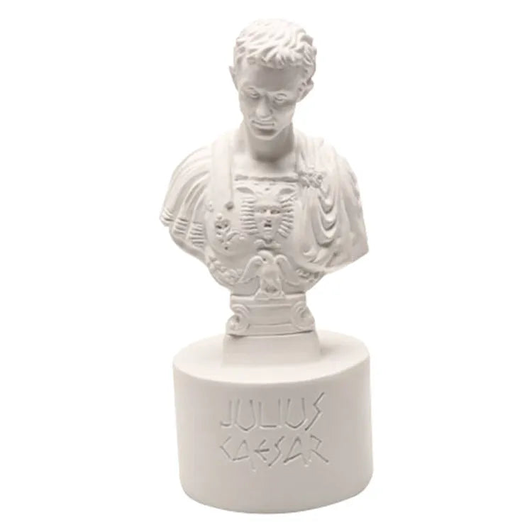 White synthetic resin pen holder with American cartoon character modelling on a desk.
