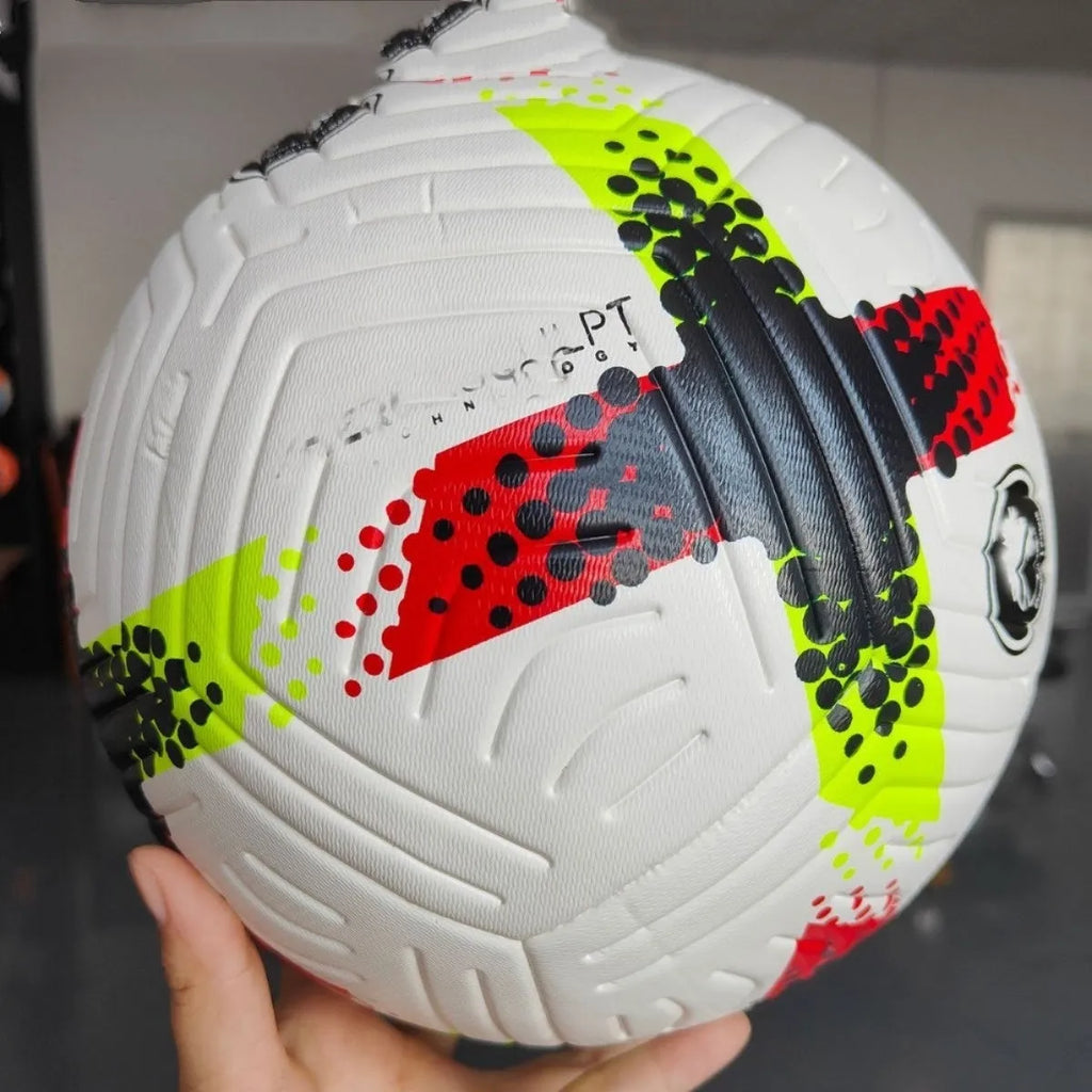 Fluorescent green official Size 5 football with seamless thermal adhesive patch PU construction on a training pitch.